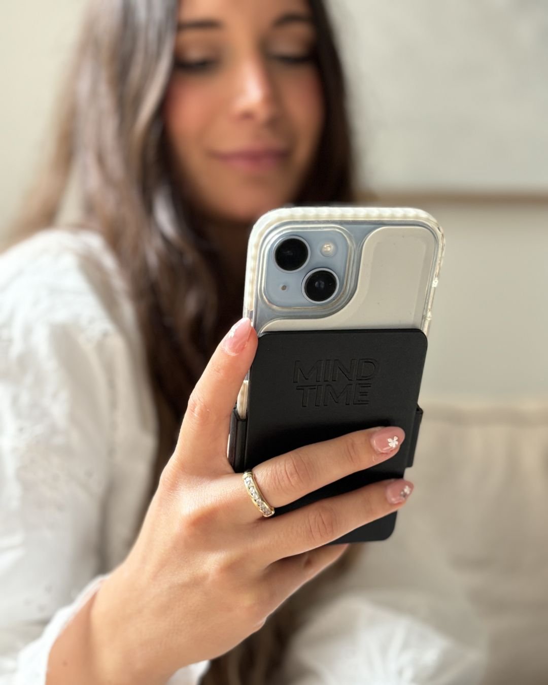 Phone in hand, screen visible, ReCover folded away.